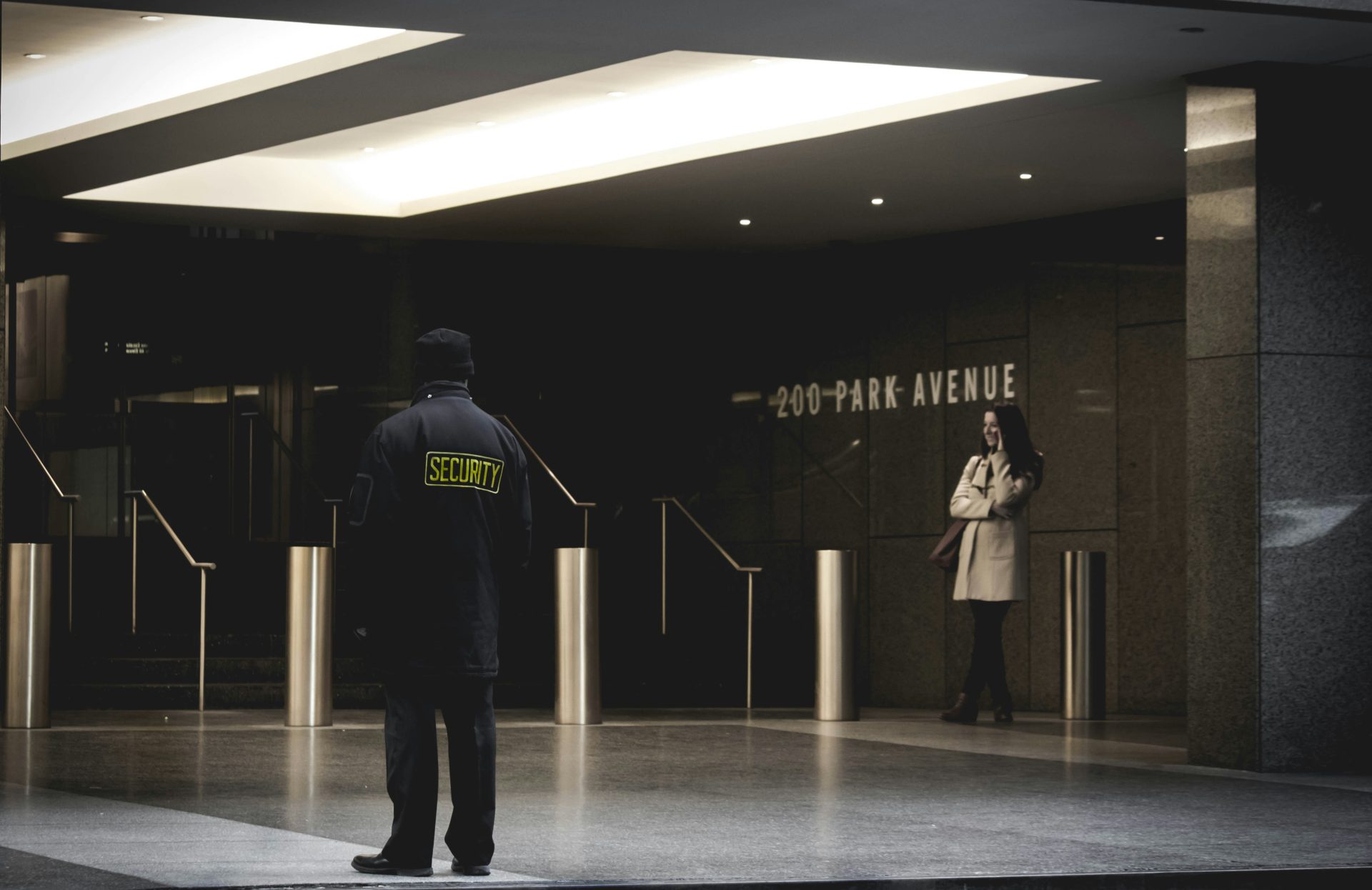 security guard standing on the gray floor